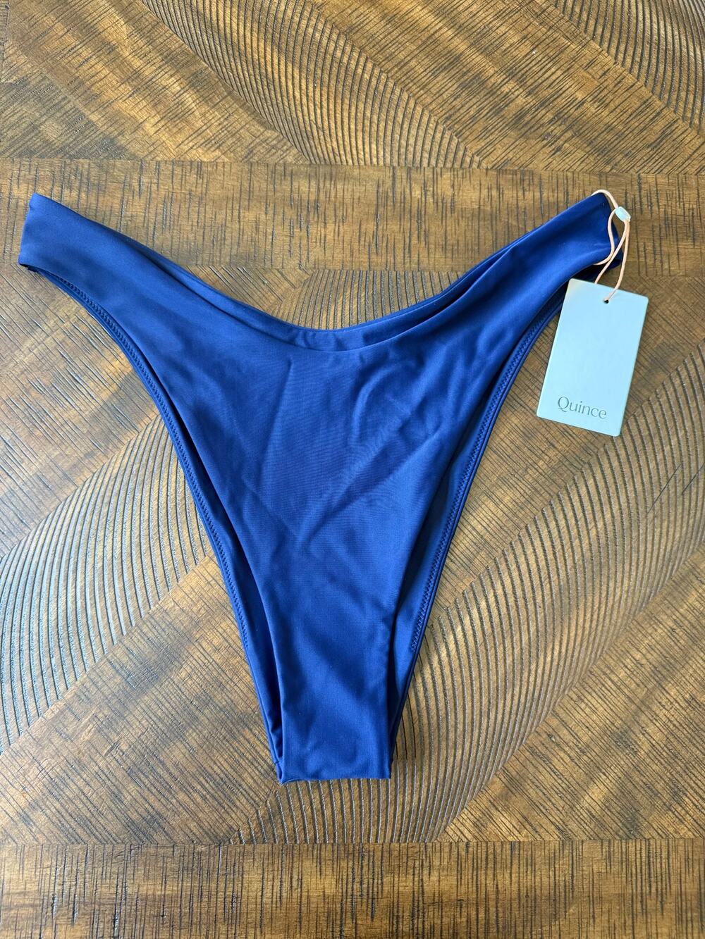 Quince bikini bottom features a high-cut design in a navy blue Large NWT